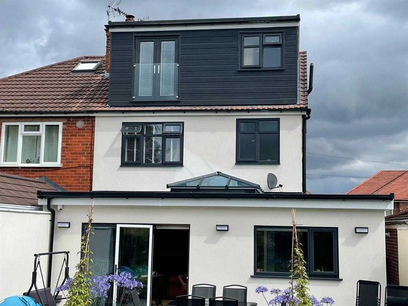 Rendered house with a completed loft conversion and dormer windows to the rear elevation