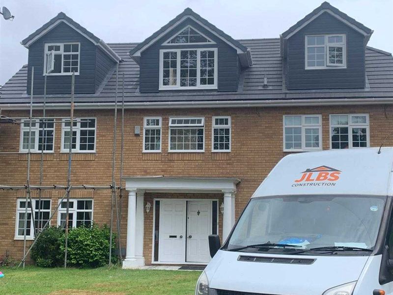 Semi detached house with a finished slate clad dormer loft conversion