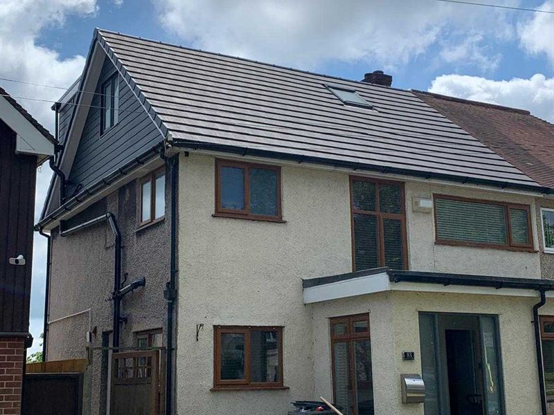 Hip to gable loft conversion completed on a semi detached house, with new render and windows