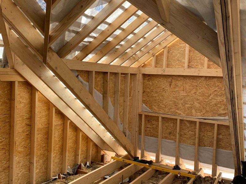 New timber roof structure and floor joists inside a loft conversion under construction