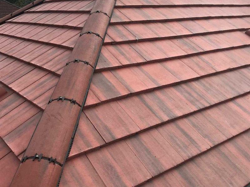 New clay tiled roof laid on a detached house