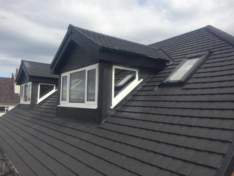 Newly slated roof with two dormer windows and a rooflight