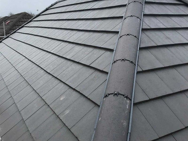 Freshly slated hipped roof with a clean ridge line and new leadwork