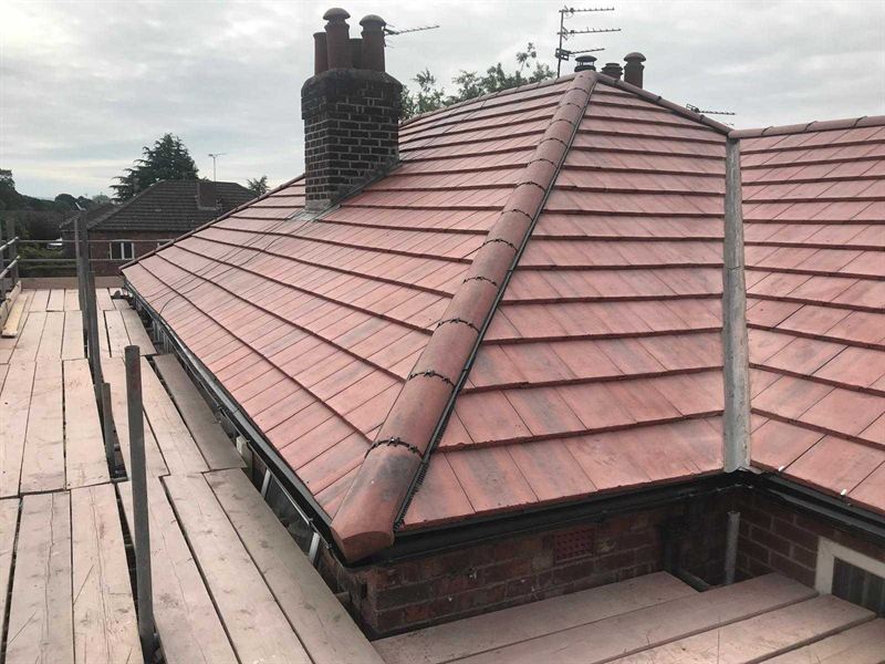 Re-tiled roof showing new leadwork to the valleys between two pitches